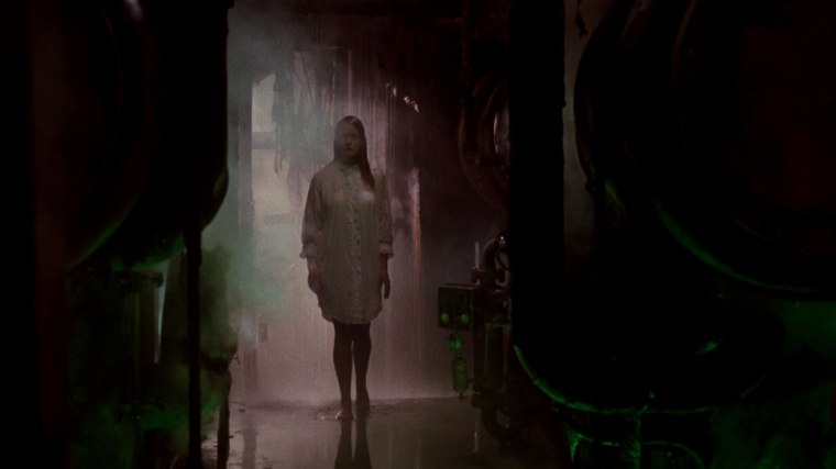 Such as here, where she's gained the ability to walk down a hallway without her shirt becoming see-through. A first for horror, hooray!