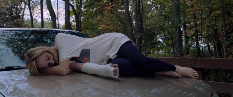 On a hot day, sleeping on the hood of a car is even less comfortable than it looks