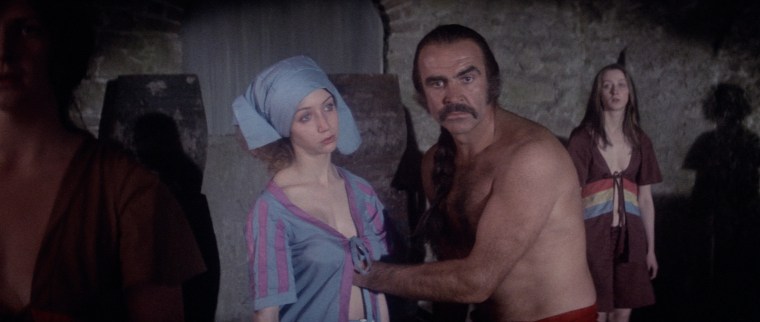 Sorry? Oh, um, I'm a doctor. I'm giving this woman a routine examination. Yes, this is standard uniform for a medical practitioner, and I'll thank you not to question me any further